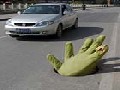 http://www.inspirefusion.com/giant-green-hand-emerges-from-manhole-in-china/